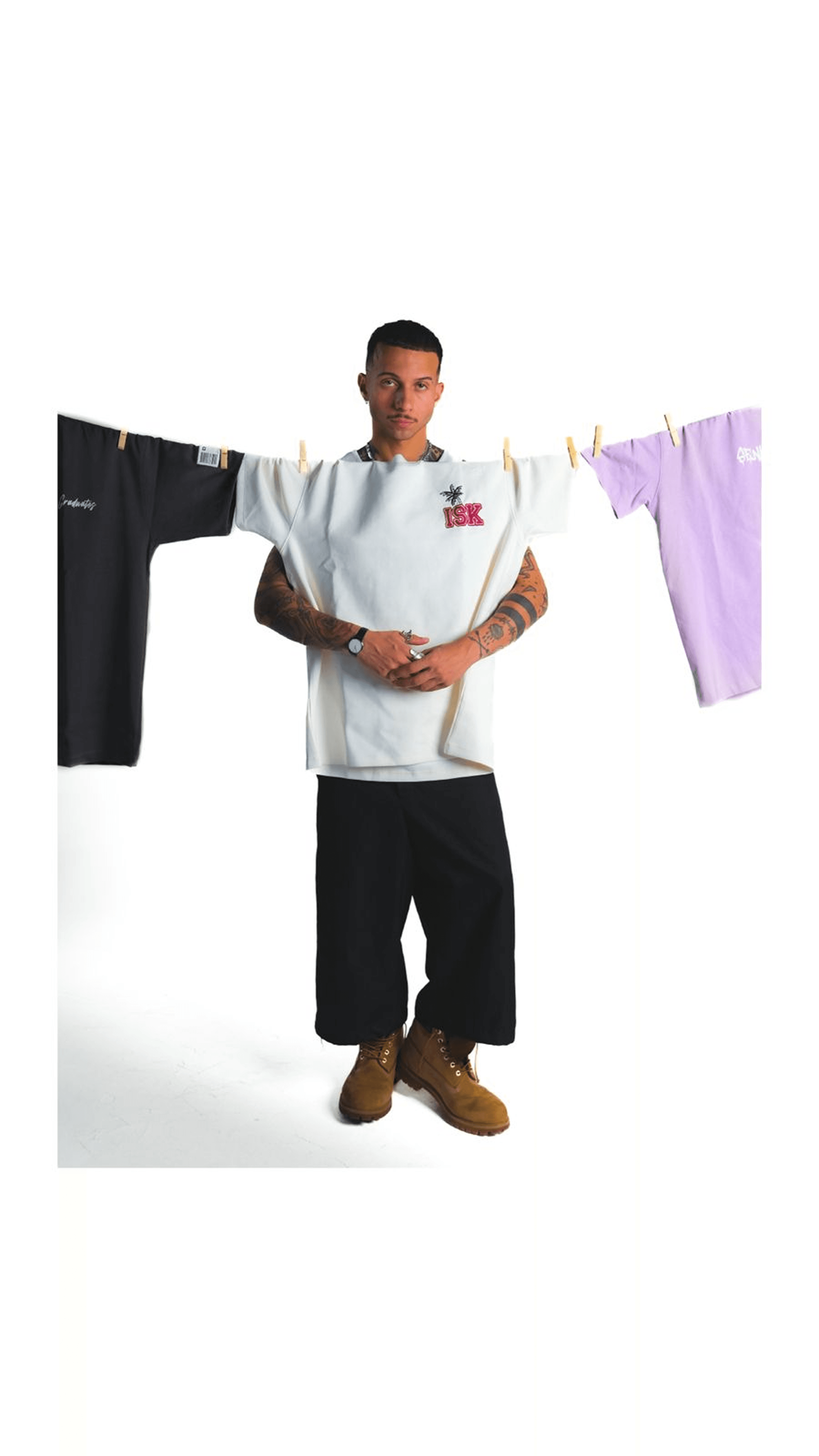 Model behind a clothesline of custom ISK senior tees